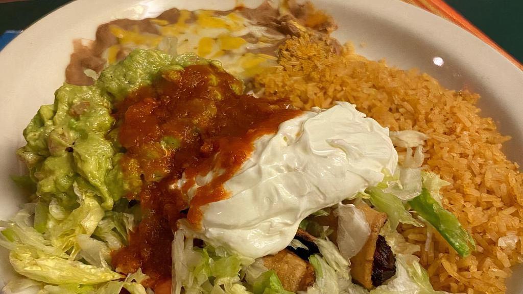#13. Two Flautas · With guacamole and sour cream.