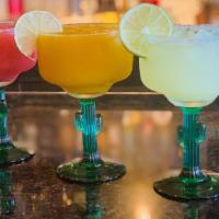 Flavored Margarita · Tequila Blanco and your choice of flavor with sweet n sour.