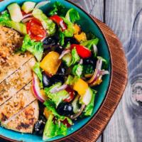 Grilled Chicken Greek Salad · Grilled chicken, lettuce, tomatoes, cucumber, kalamata olives,  and feta cheese served with ...