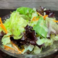 House Salad · mixed green salad served in house dressing.