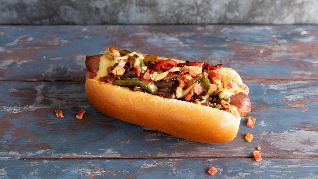 Loaded Dog · Signature hot dog smothered in cheese sauce, bacon, mixed grilled onion & peppers and spicy mustard
