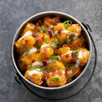 Loaded Tots · Crispy potato tots, cheese sauce, bacon, green onions, and ranch dressing I add caramelized ...