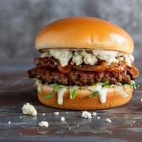 Steakhouse Burger · Grilled Impossible ™ burger patty, caramelized onions, blue cheese crumbles, lettuce, and ho...