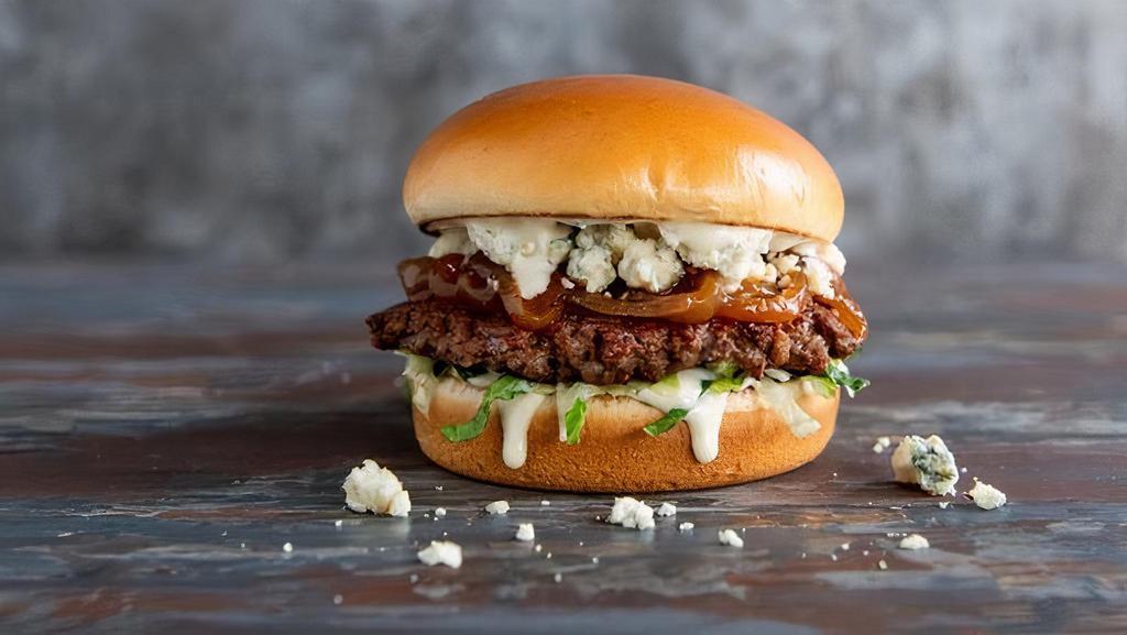 Steakhouse Burger · Grilled Impossible ™ burger patty, caramelized onions, blue cheese crumbles, lettuce, and horseradish aioli