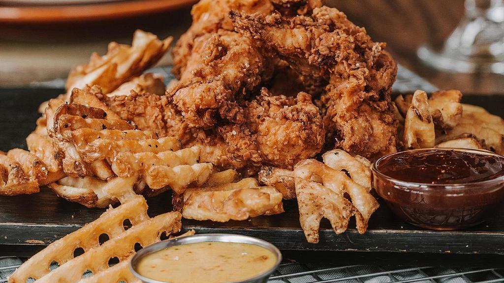 Twisted Tenders Party Pack · 20 chef crafted chicken tenders. Crispy buttermilk marinated tenders breaded in twisted flour. Choice of 2 sauces..