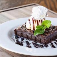 Stout Fudge Brownie Party Pack · Fudge brownie, chocolate drizzle and powdered sugar.