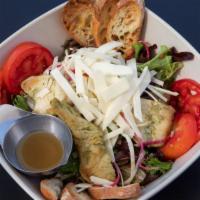 Pollo · Grilled chicken with organic lettuce, roasted walnuts, root vegetable medley, sliced tomato,...