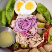 Pantesca  · Housemade preserved tuna on a bed of butter lettuce with poached potato, red onion, capers, ...