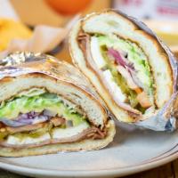 Torta Cubana  $10 · A Mexican sandwich with egg, ham, milanesa either chicken or beef, cheese, lettuce, tomatoes...