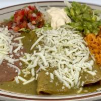 ENCHILADAS VERDES $18 · Two enchiladas topped off with a savory green salsa stuffed with your choice of chicken or c...