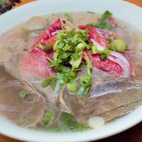 13.Combination Beef Noodle Soup火车头 · Rare slices beef, brisket, tendon,beef balls with green onion, purple onion, cilantro,rice n...