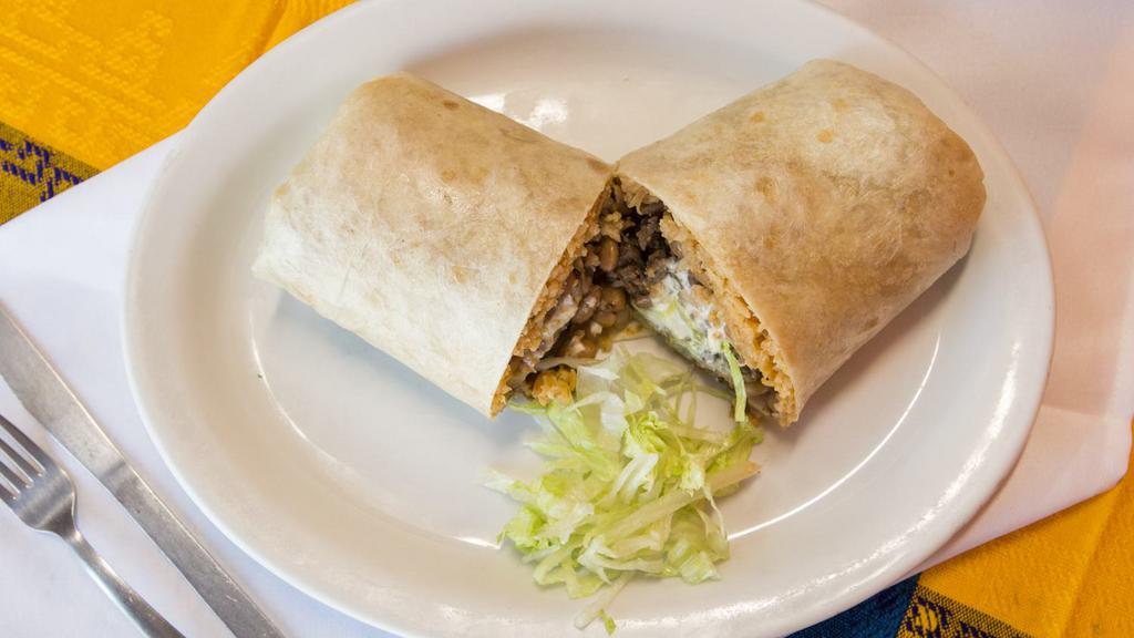 Regular Burrito · 1 Choice of meat, rice, beans, and mild salsa. Add lengua for an additional charge.