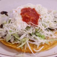 Super Taco · Choice of meat, lettuce, cheese, sour cream, guacamole and ranchera salsa on a corn tortilla...