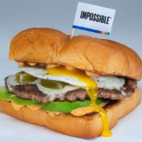 Chipotle Avocado Burger · White american cheese, avocado, pickled jalapenos, cotija cheese, fried egg, chipotle aioli