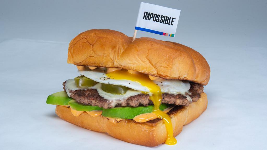 Chipotle Avocado Burger · White american cheese, avocado, pickled jalapenos, cotija cheese, fried egg, chipotle aioli
