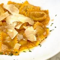 RAVIOLI · homemade pasta, short rib, ricotta, grana padano, red wine reduction