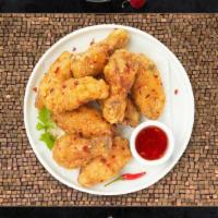 Red Chicken Wings · Chicken wings a our own tangy sweet a spicy sauce.