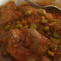 Mater Challaw · Saucy slow cooked chunks of lamb cooked with green peas, onions, and tomatoes. Served with c...
