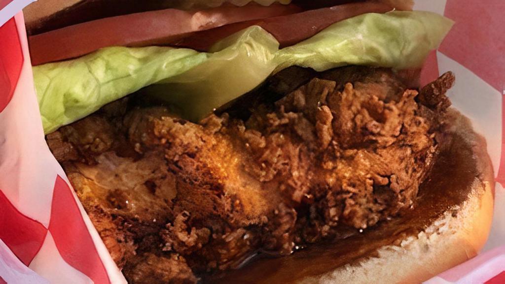 Crispy Chicken Sandwich · Made to order crispy chicken sandwich. Our chicken marinated in a secret blend of ingredients then ran through a dredge and fried to a crispy perfection. Lettuce, tomato and pickle topped with spicy or plain mayo.
