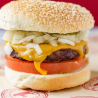 Lombard Burger · Sumac-mustard, diced onion, tomato, pickles, sharp cheddar cheese, toasted sesame seed bun.
