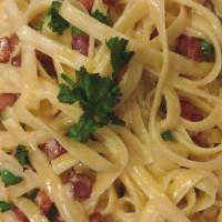 Fettuccini Carbonara · Served with pancetta and light cream sauce.