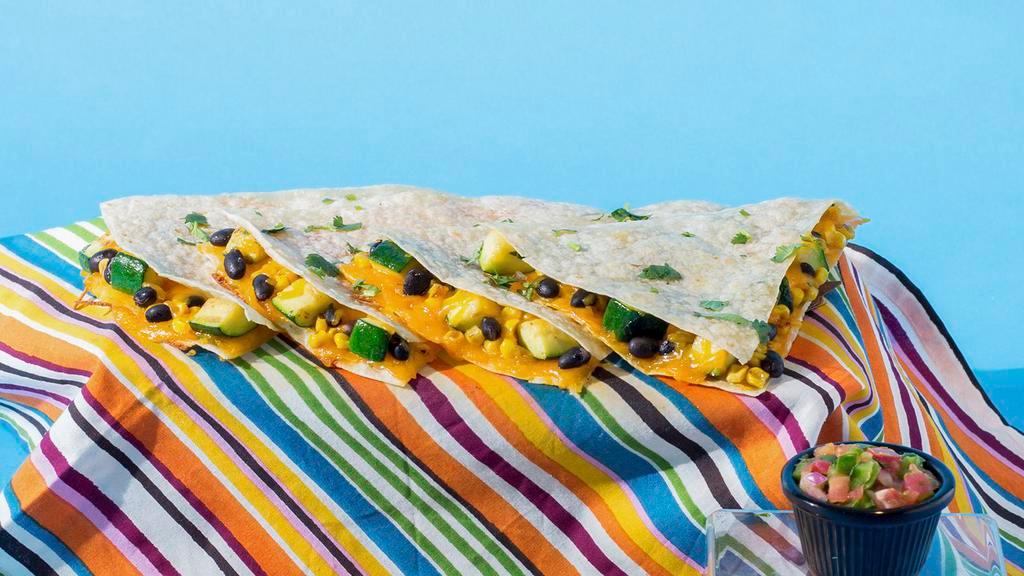 Veggie Quesadilla · Zucchini, corn, and shredded melted cheese in a crispy flour tortilla and served with a side of pico de gallo and sour cream.