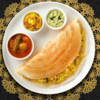 On and Onion Masala Dosa · Savory crepe made of rice & lentil batter topped with onions served with chutneys and Sambar