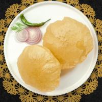 Poori · Two pieces. Deep fried puffed bread.