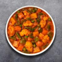 V For Vegetable Curry · Mixed vegetables cooked with ground spices and curry sauce.
