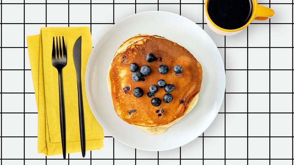 LABC Blueberry Pancakes · Two fluffy pancakes with blueberries served with a side of butter and syrup. Stack.It.Up.