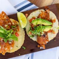 TACOS AL PASTOR · Six sliced pork meat tacos, corn tortilla, tomatillo & avocado salsa, cilantro, onions, pine...