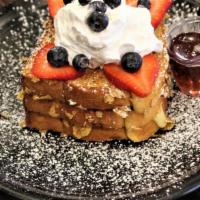 Corn Flakes French Toast · THREE SLICES OF TOAST DIPPED IN CREAM, COATED WITH CORN FLAKES, STUFFED WITH VANILLA CUSTARD...