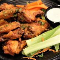 Wings · WITH YOUR CHOICE OF BUFFALO, OR BBQ SAUCE. SERVED WITH CELERY STICKS, CARROTS AND. BLUE CHEE...