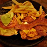 Crispy Buffalo Chicken · WITH PEPPER JACK CHEESE, AVOCADO, HARDWOOD SMOKED HONEY CURED BACON, LETTUCE, TOMATOES AND R...