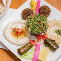 Veggie Plate · Served with pita bread. Hummus, baba ganouje, tabbouli, two falafels and two dolmas.