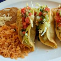 8. Crispy Taco Plate (3) · Three crispy tacos  topped with lettuce, cheese and pico de gallo, with rice and beans.
Now ...