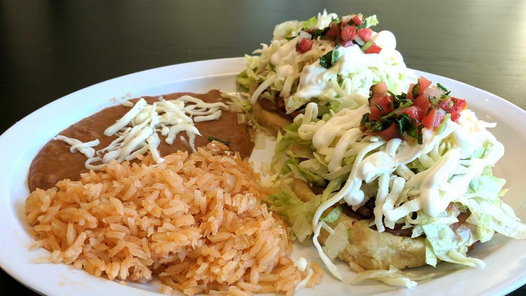 9. Sope Plate · Two delicious home made sopes topped with meat, beans, lettuce, sour cream, cheese , guacamole and pico de gallo with rice and beans.
Now any meat of your choosing at no additional charge except for Shrimp or Fish