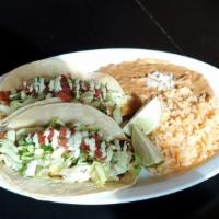 17. Fish Taco Plate · Two fish tacos made with veggies, lettuce, pico de gallo and home made special cilantro dres...