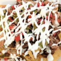 Super Nachos · Chips topped with meat, beans, cheese, guacamole, sour cream, pico de gallo and chiles jalap...