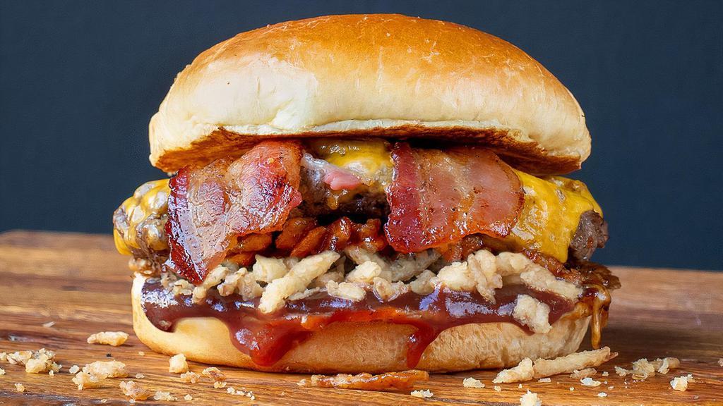 Impossible Bbq Bacon · Our Impossible plant-based patty loaded with melted cheddar, smoked bacon, crispy onions, Memphis-style bbq sauce on a toasted, artisan bun