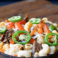 Steak Fajita Mac · Grilled steak with our custom cheese blend, onions, red peppers and jalapeños topped with ch...