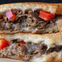 Steak & Cheese · Grilled steak, provolone, melted cheddar, caramelized onions, red peppers and jalapenos on a...