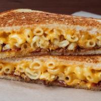 Mac Daddy Cheese · Creamy mac ‘n’ cheese, aged cheddar, smoked bacon on artisan french bread. Includes pickle o...