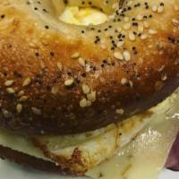 Egg Breakfast Bagel · Includes: scrambled eggs, ham, bacon or sausage with cheese on bagel.