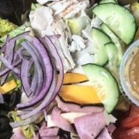 Chef Salad · Served on a bed of greens with tomato, cucumber, olives, red onion, pepperoncini, ham, turke...