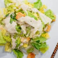 Caesar Salad · Romaine lettuce, croutons, and Parmesan cheese. Tossed with Caesar dressing.