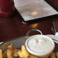 Skillet Cheese Fries · Melted Cheddar and Jack cheeses, diced bacon and jalapeños. Served with a side of ranch dres...