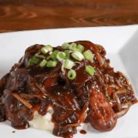 Bangers & Mash · Banger sausages covered with Guinness onion gravy and green onions served over mashed potato...
