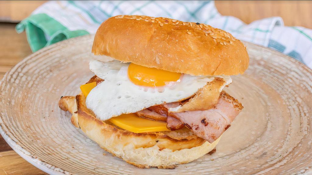 Ham Egg & Cheese · Scrambled eggs, ham, and melted cheddar cheese on your choice of bread.