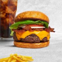 Bacon Stash Burger · American beef patty topped with melted cheese, layers of crispy bacon, lettuce, tomato, cara...